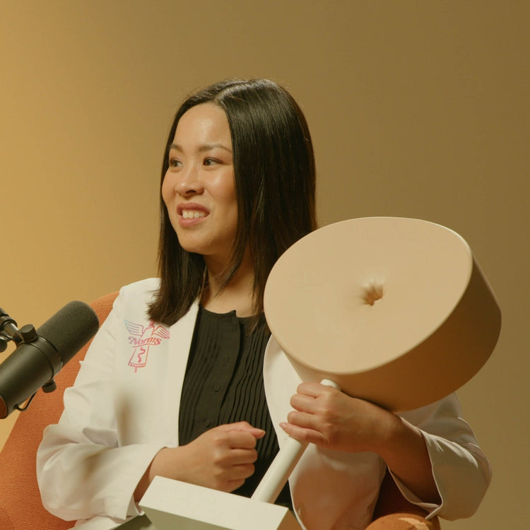 Person holding a hemorrhoid treatment model